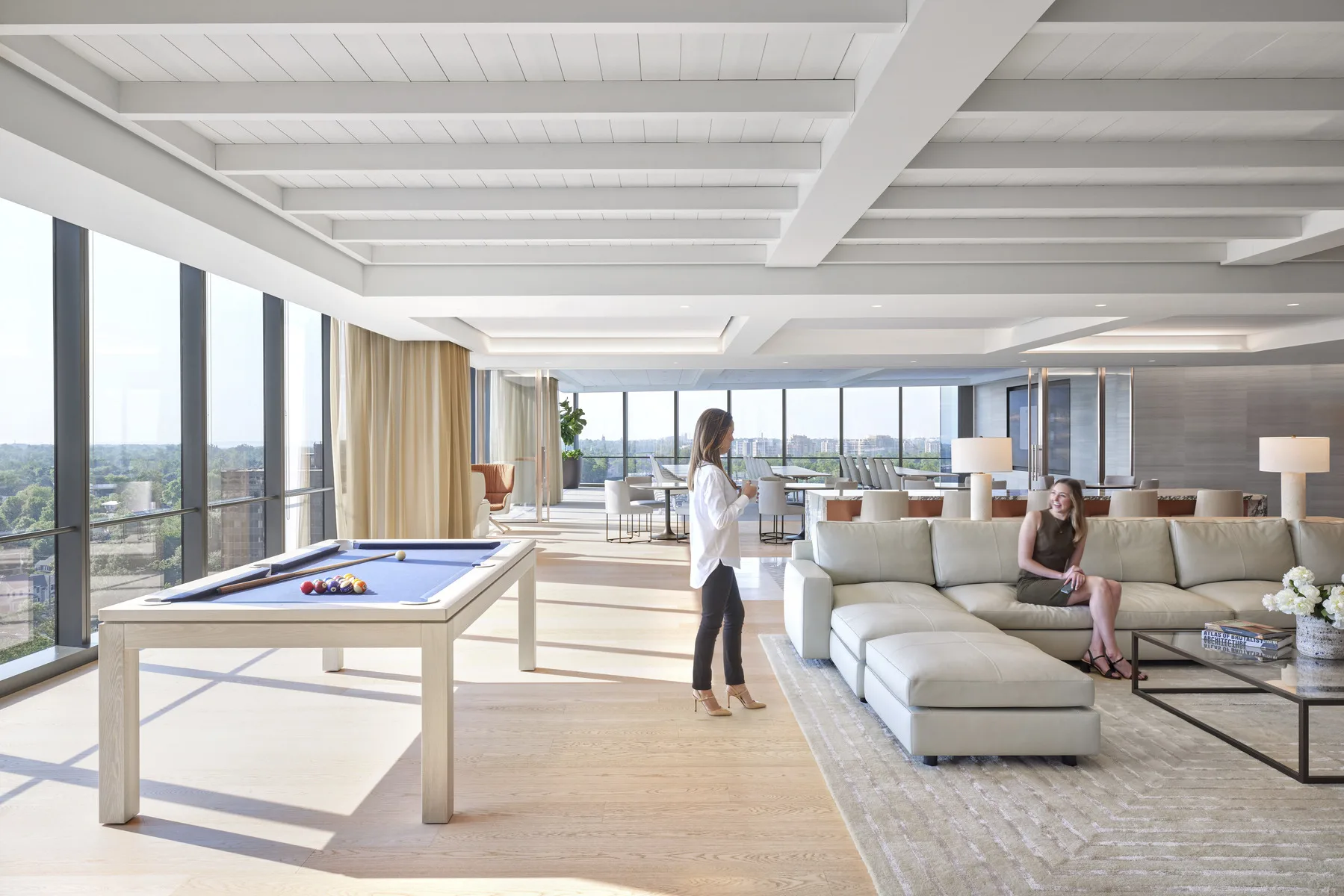 Corporate real estate professional exploring the new workplace realities with their new space management software.